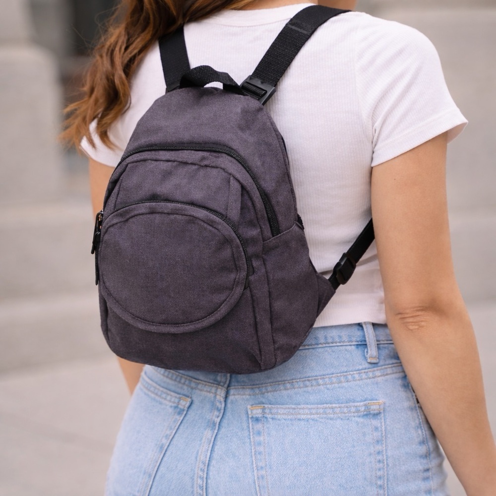 Kendall & James: 🖤 Sleek Gray Sling Backpack – Compact & Stylish! 🖤